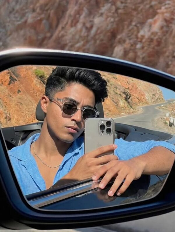 Rear-View Mirror Selfie in Convertible Car