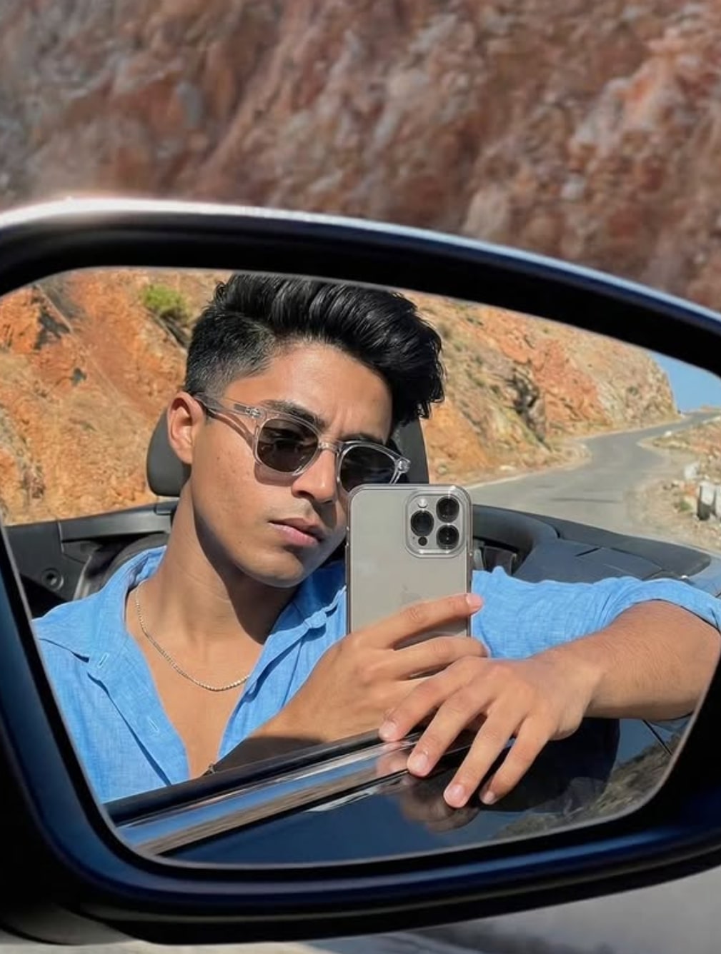 Rear-View Mirror Selfie in Convertible Car