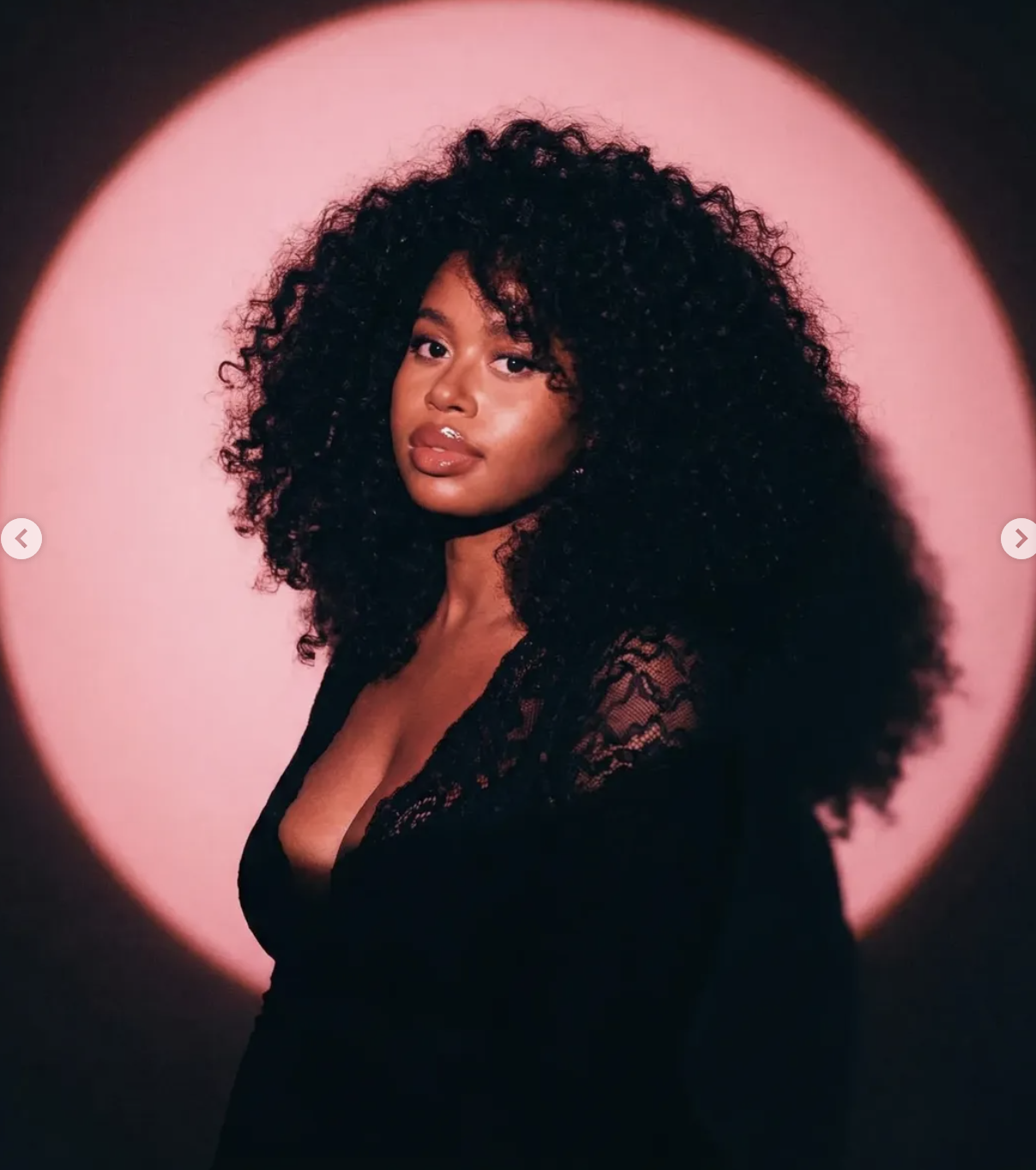 voluminous dark curly hair